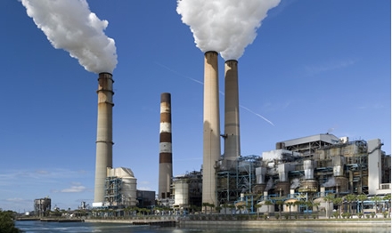 Why are defoamers used in power plant flue gas desulfurization?